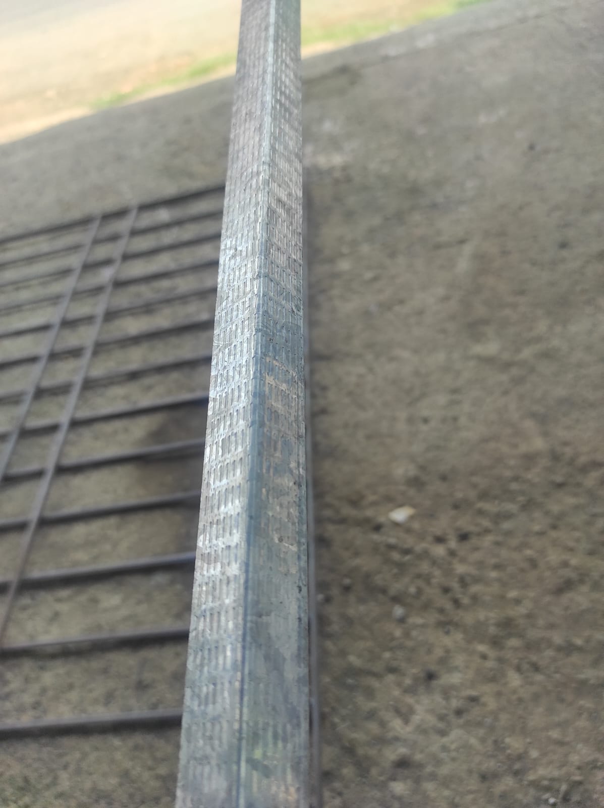 Galvanized steel L-angle channel edge profile close-up